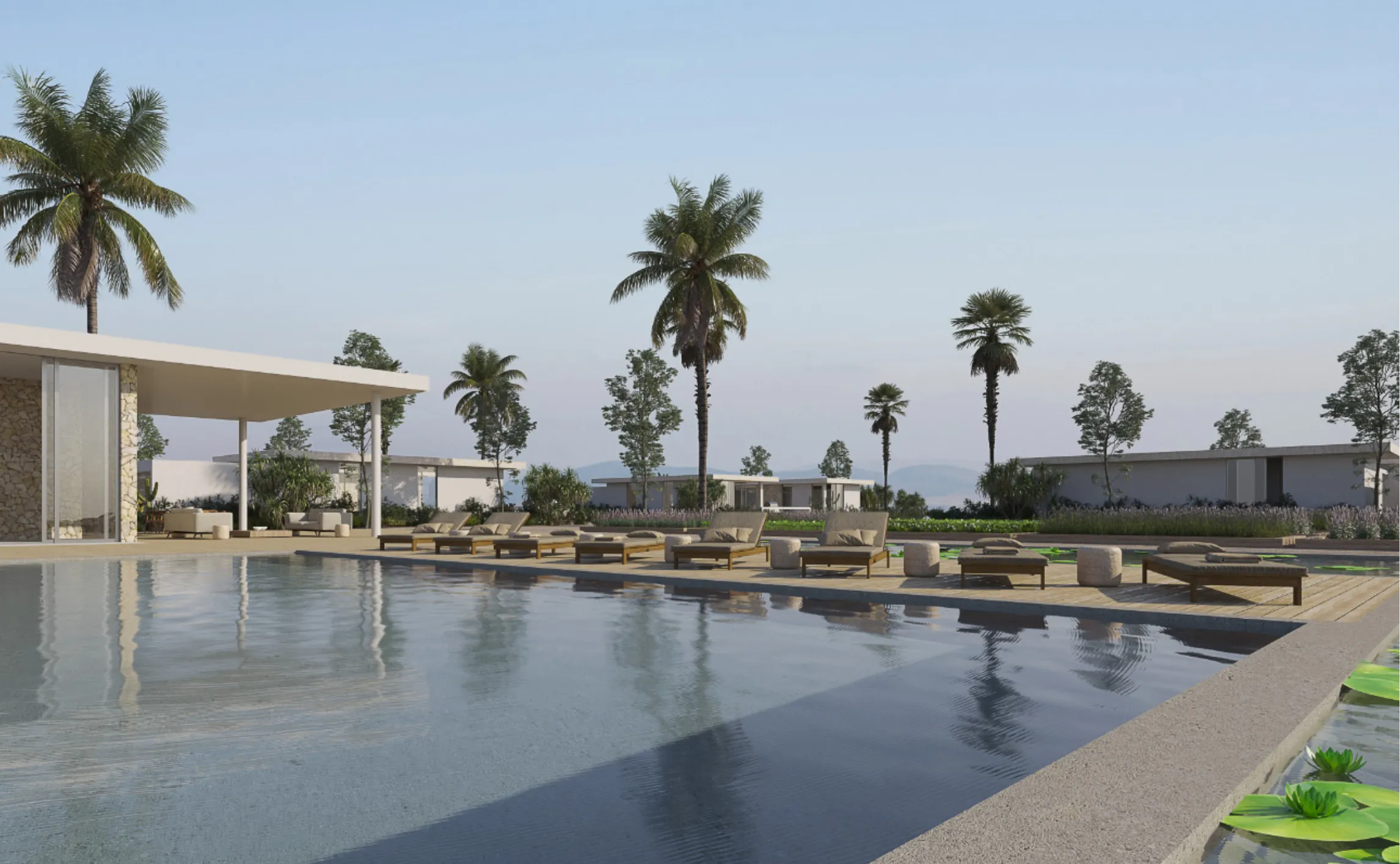 A pool surrounded by lounge chairs and palm trees.