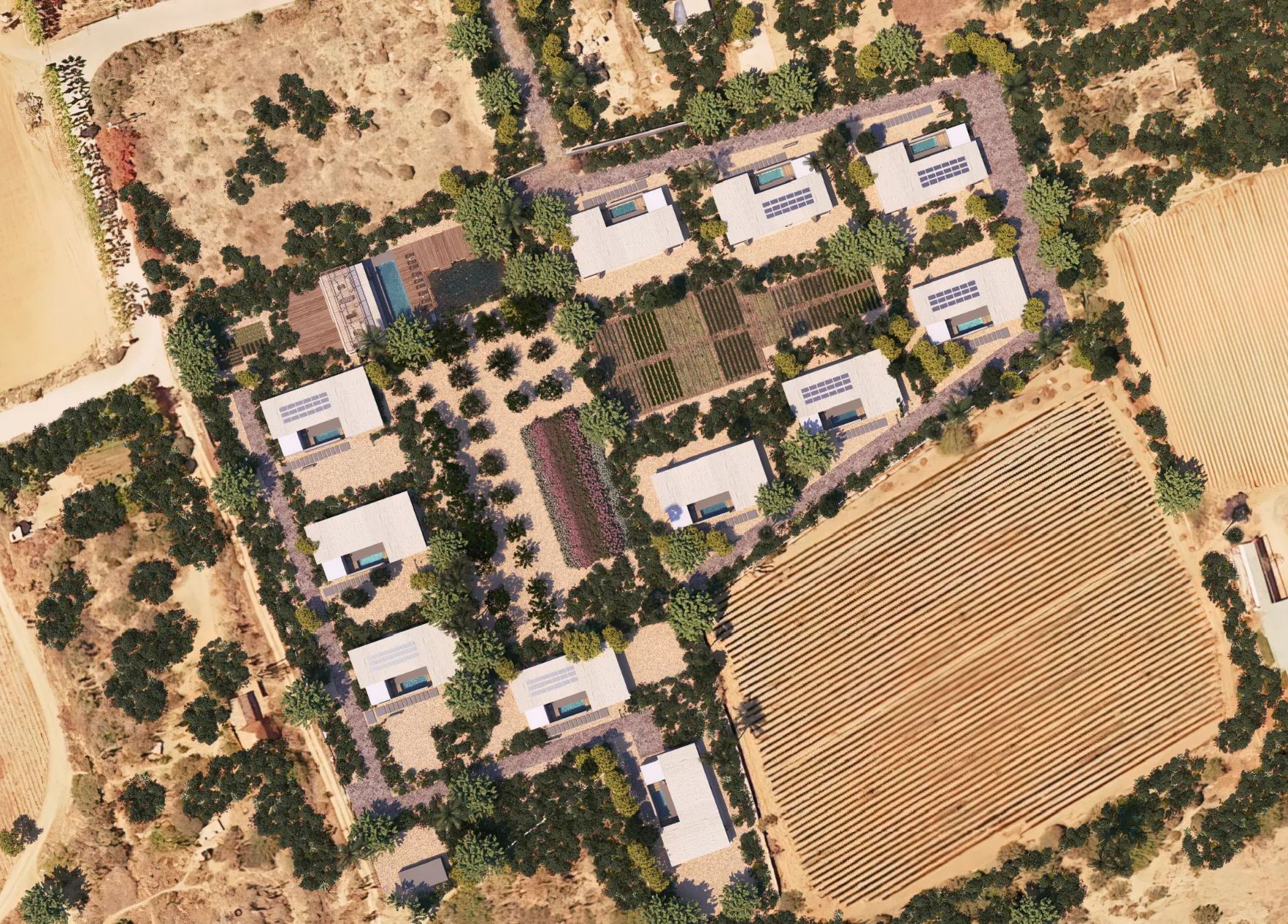 Overhead shot of a vast residential community with houses, roads, and green spaces.